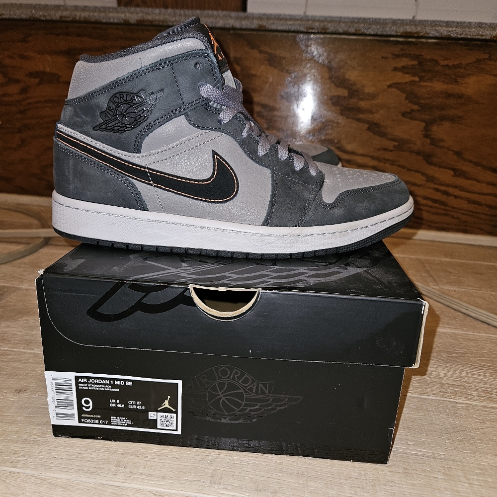 Jordan Gray and Black Sneakers with High-Top Design and Lace-Up Closure